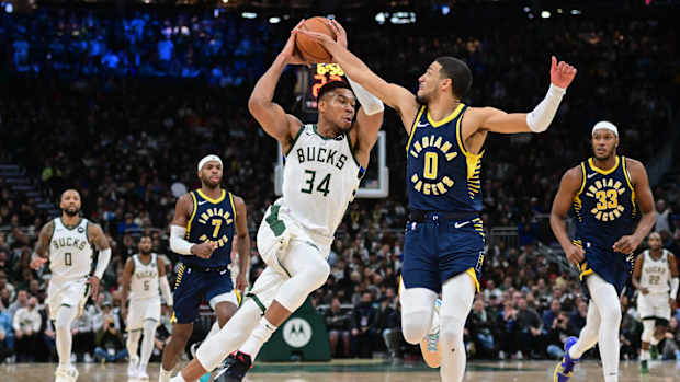 Milwaukee Bucks forward Giannis Antetokounmpo (34) drives for the basket against Indiana Pacers guard Tyrese Haliburton (0) i